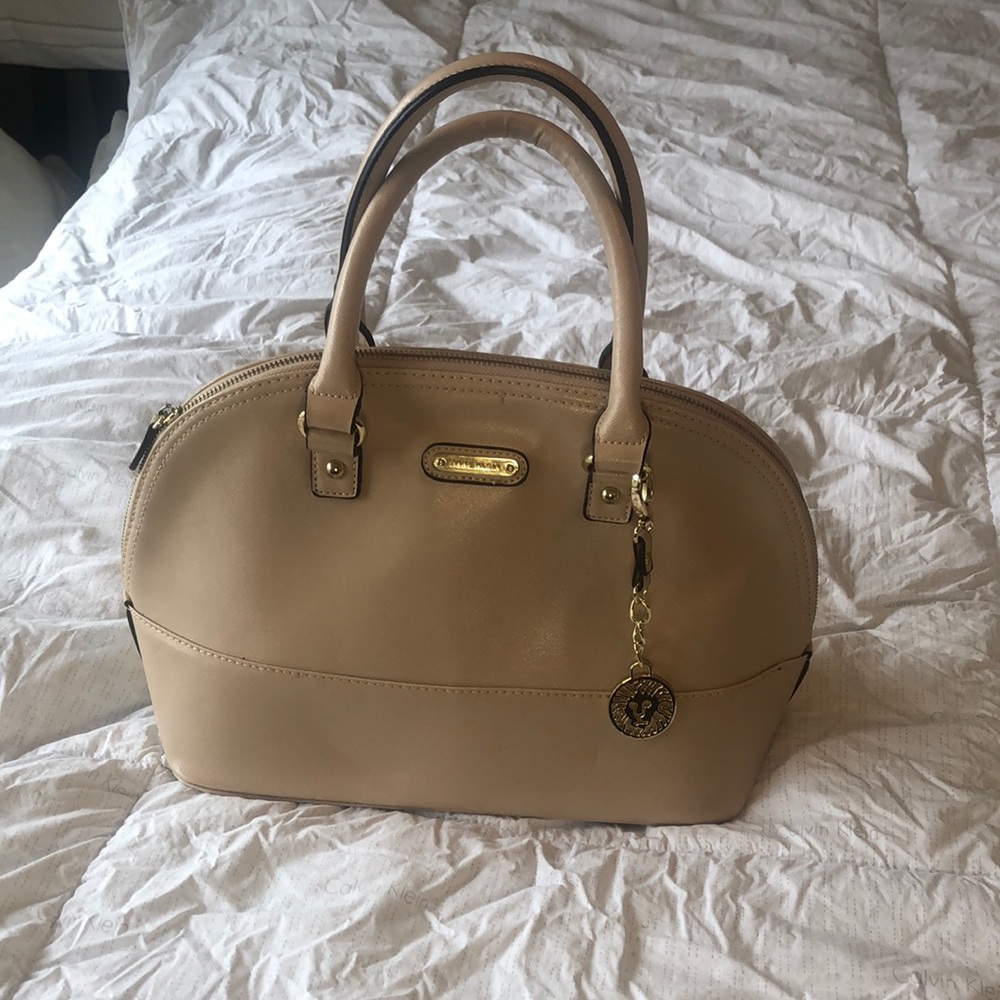 Beige colored Anne Klein bag.